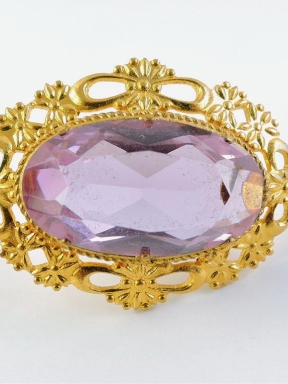 Gold Tone Ornate Brooch with Lavender Oval Gemstone